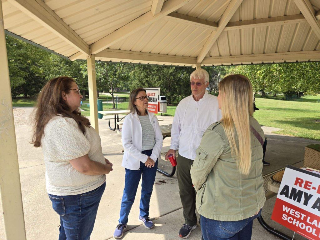 Amy Austin talks to voters at public event