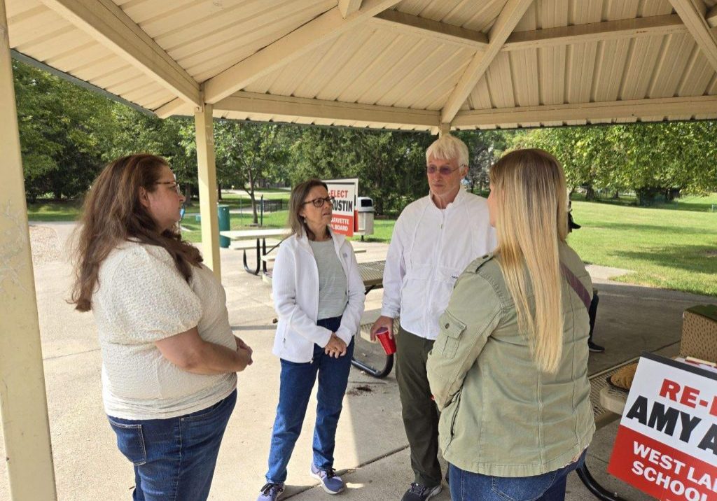 Amy Austin talks to voters at public event